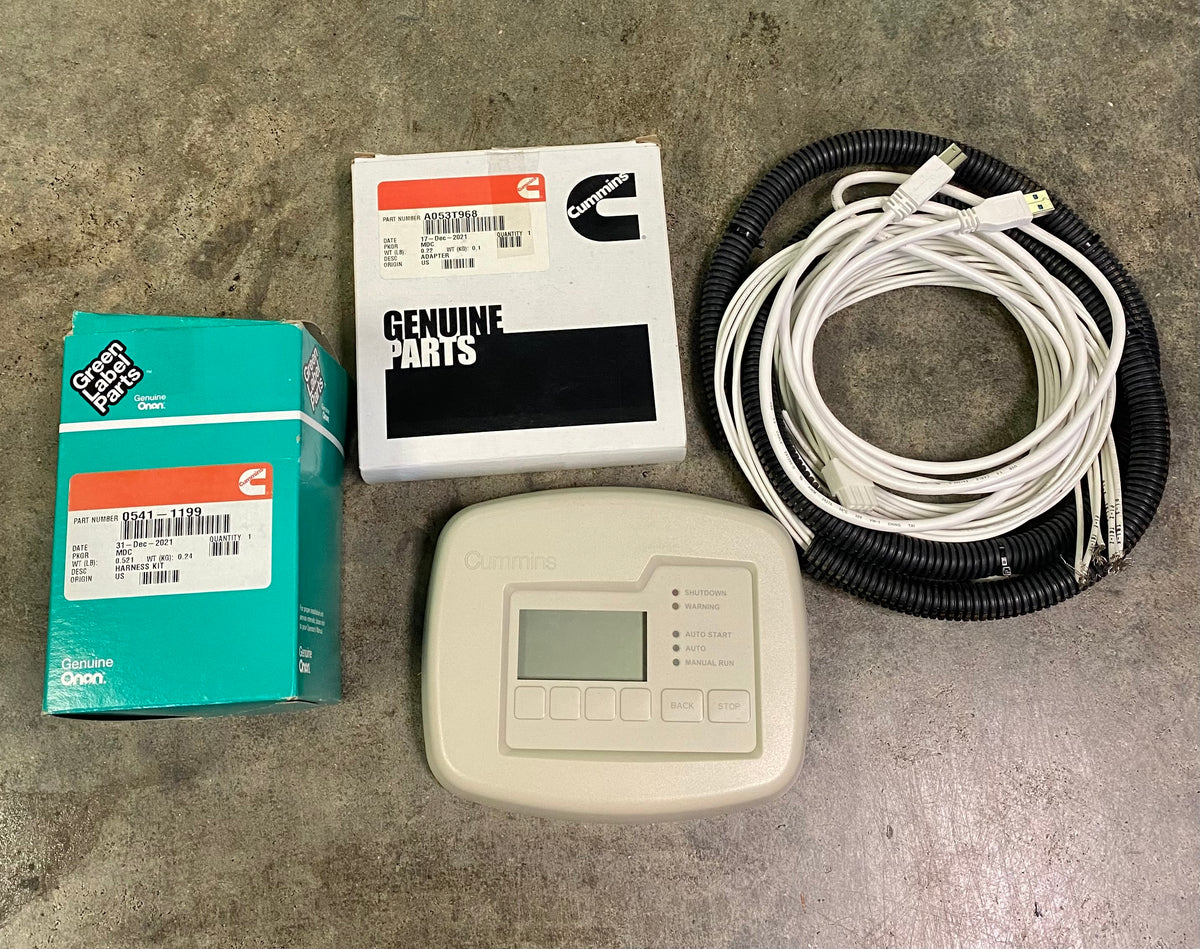 Genuine parts kit for a Whirlpool water heater, including a replacement control panel, white cables in a black corrugated sleeve, a white branded box, and a teal GAF box, displayed on a concrete floor.